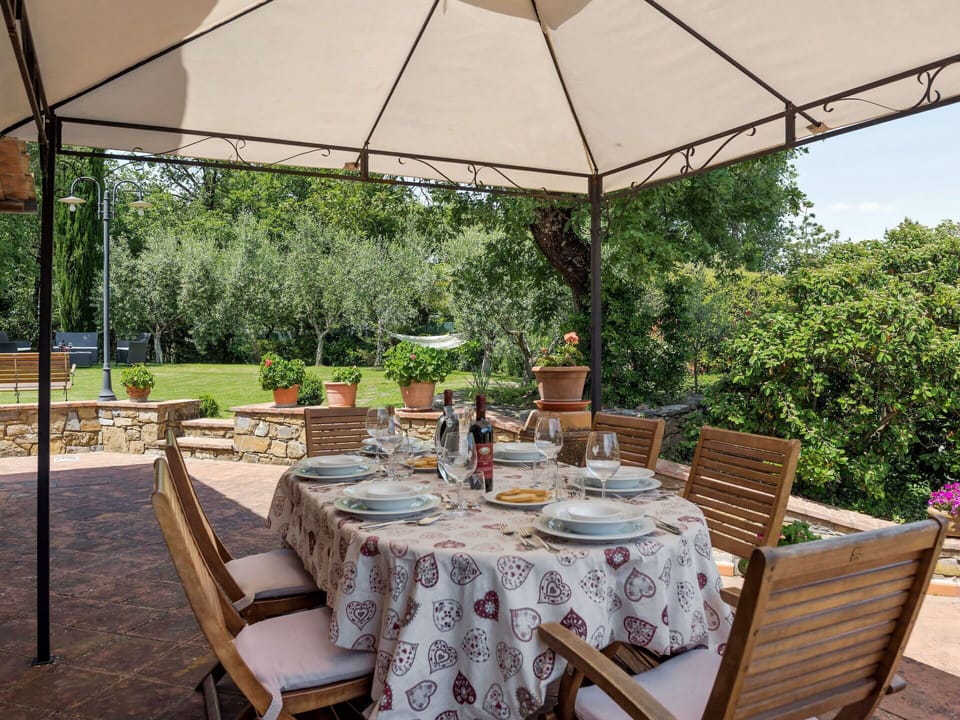 Table, Plant, Furniture, Property, Tableware, Chair, Outdoor Table, Shade, Outdoor Furniture, Building
