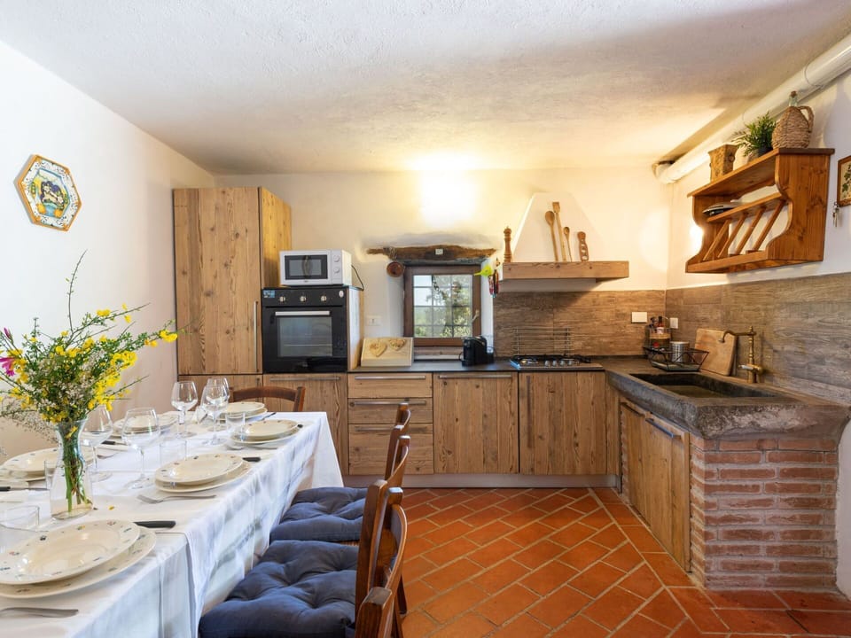Countertop, Property, Cabinetry, Furniture, Kitchen, Interior Design, Wood, Table, Flooring, Floor