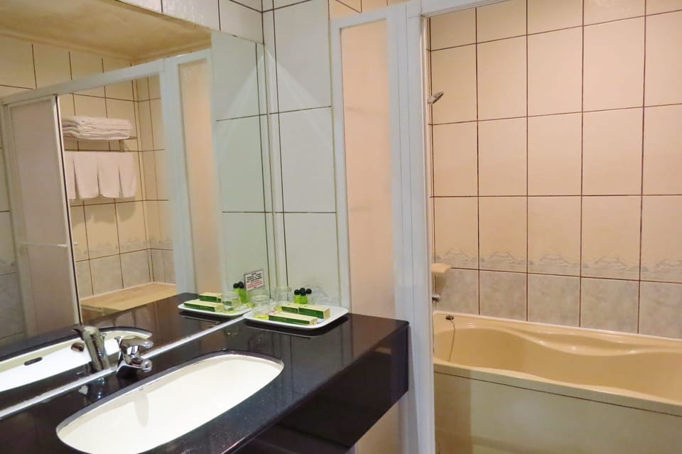 Superior Quadruple Room, 2 Queen Beds, Bathtub | Bathroom | Free toiletries, hair dryer, slippers, towels