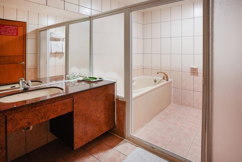 Superior Quadruple Room, 2 Queen Beds, Bathtub | Bathroom | Free toiletries, hair dryer, slippers, towels