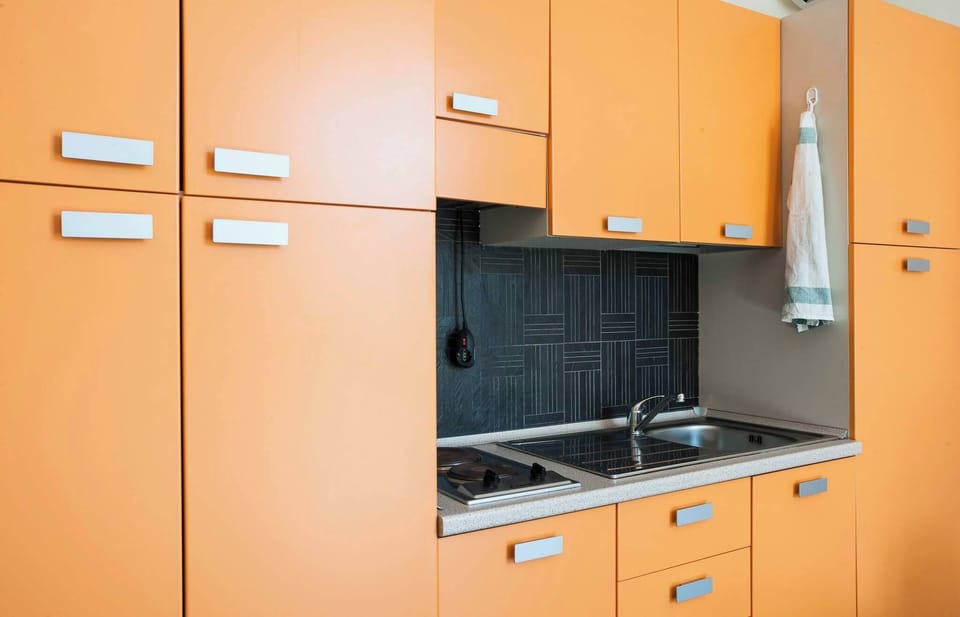 Apartment, 1 Bedroom, Balcony, Garden View | Private kitchen | Coffee/tea maker, highchair