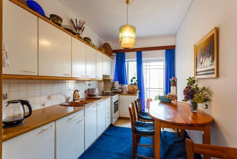 Kitchen Area – Functional kitchen with ample counter space and light.