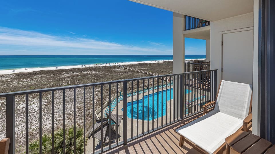 Relax in your chair on the balcony as you take in the stunning coastal views and the sounds of beach life