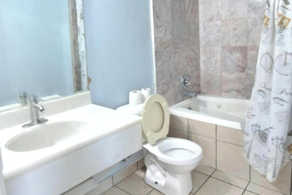 Room, 2 Queen Beds, Non Smoking | Bathroom | Combined shower/tub, free toiletries, hair dryer, towels
