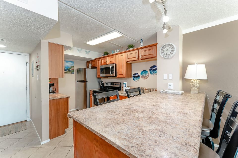 Our kitchenette has full-size appliances and seating for 4. Whether you're entertaining or enjoying a night in playing board games, you're going to love taking your vacation at South Padre Island!