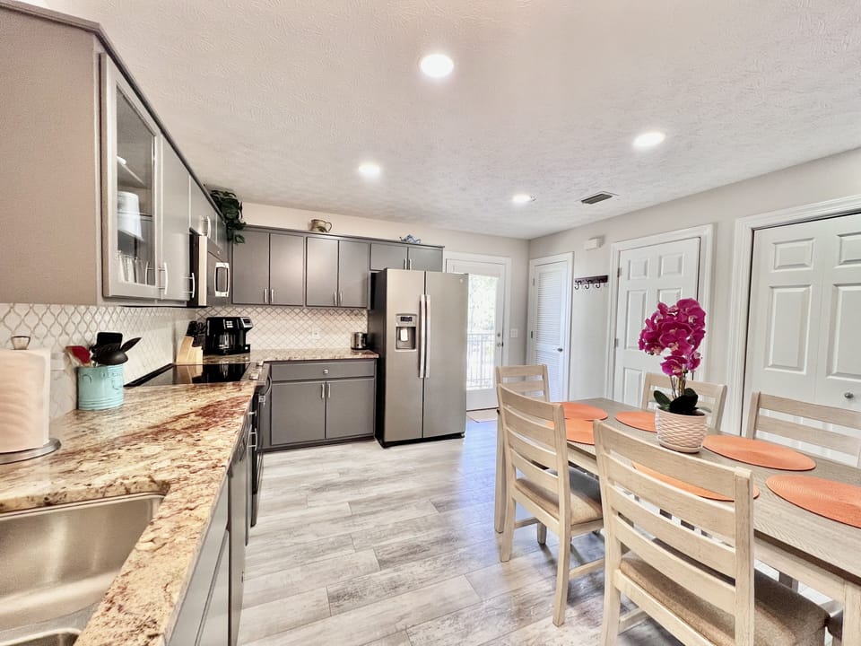 Kitchen area with RO water dispenser. 