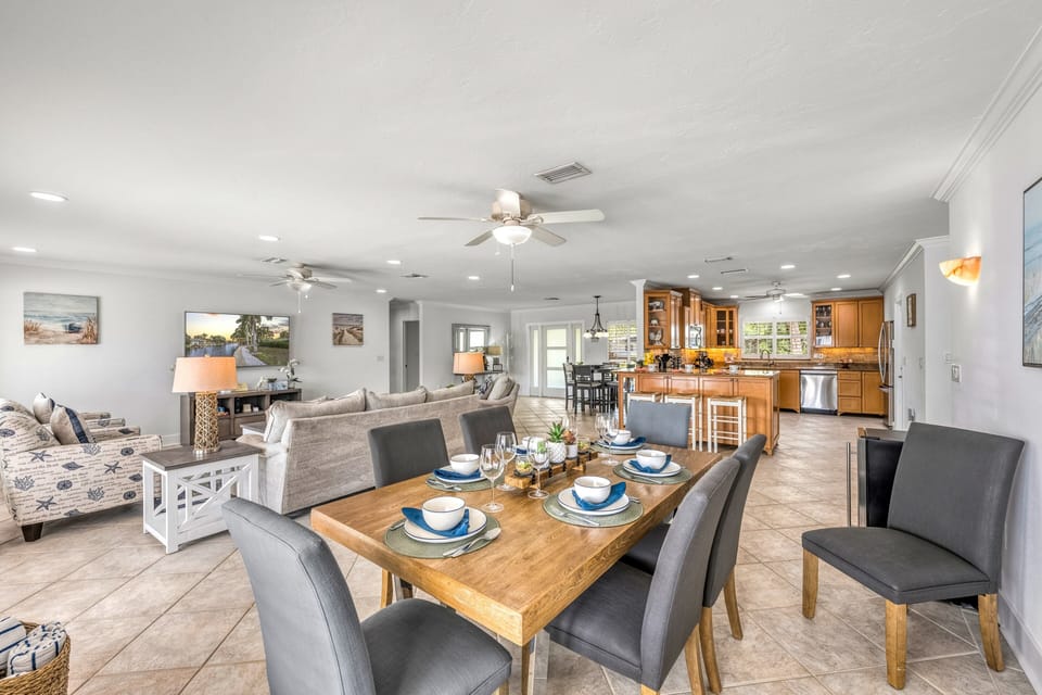 The open kitchen flows seamlessly into the dining area, creating an ideal gathering space for your group.