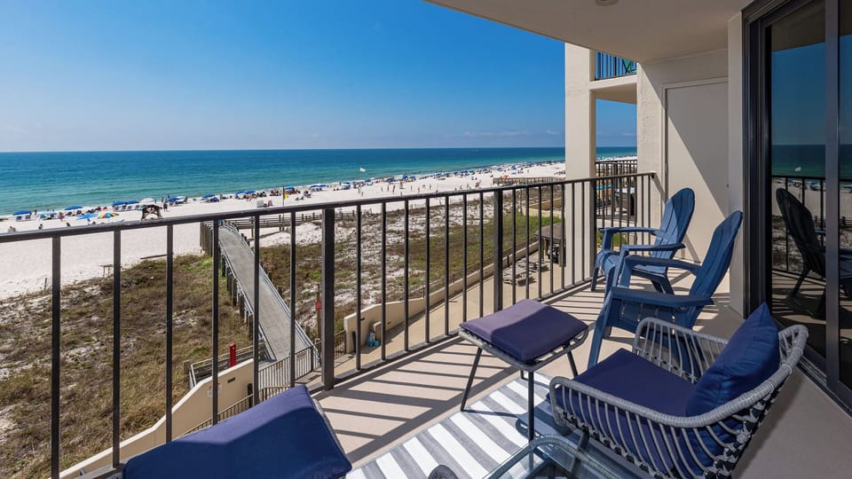 Gentle gulf breezes surround your balcony where you relax in cushioned chairs and watch waves lap the shore