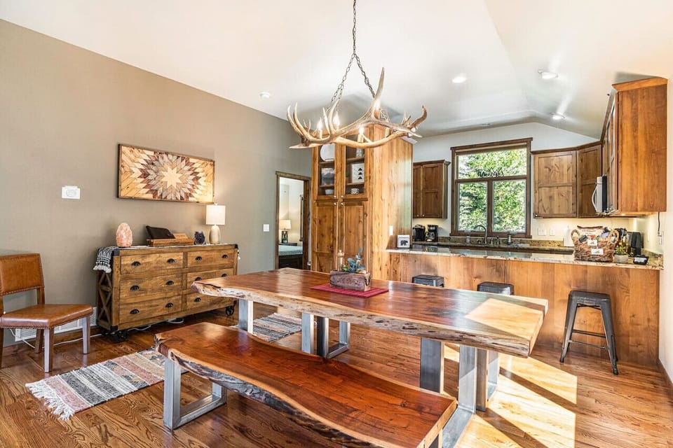 Live edge dining room table and antler chandelier