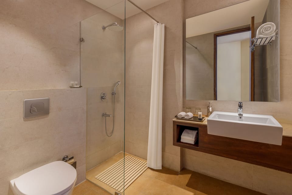 Shower, rainfall showerhead, slippers, towels