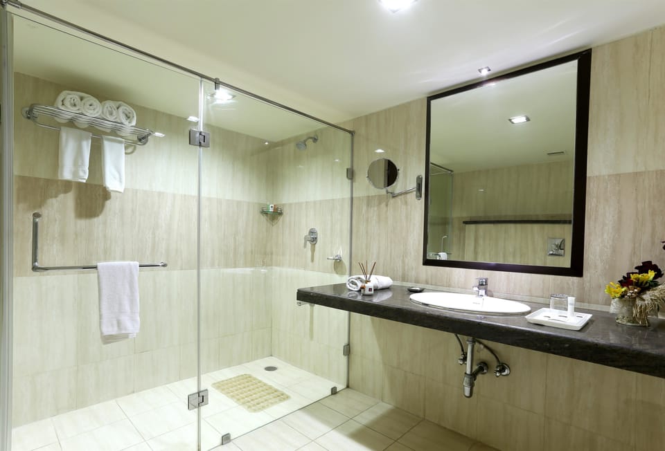 Designer toiletries, hair dryer, slippers, bidet