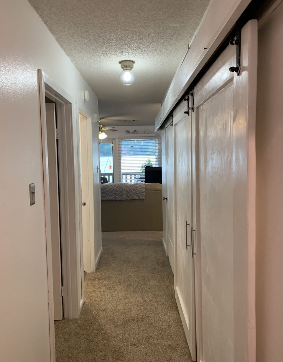 View from entryway...laundry area behind barn doors on the right