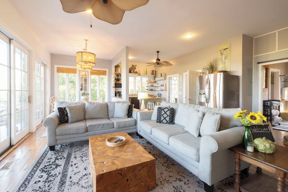 spacious living area looking into the kitchen and dining area