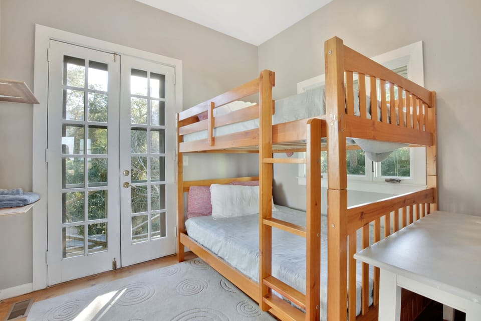 Last bedroom with queen size bunk beds and private attached full bathroom