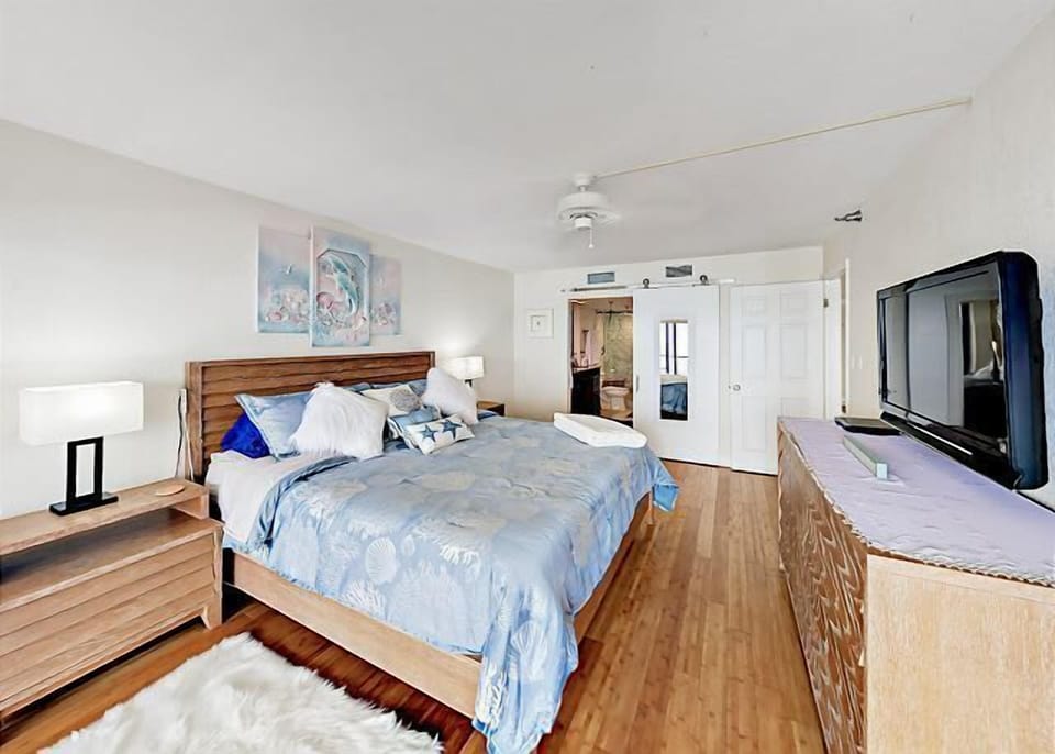 King size master with en-suite bath and balcony access.