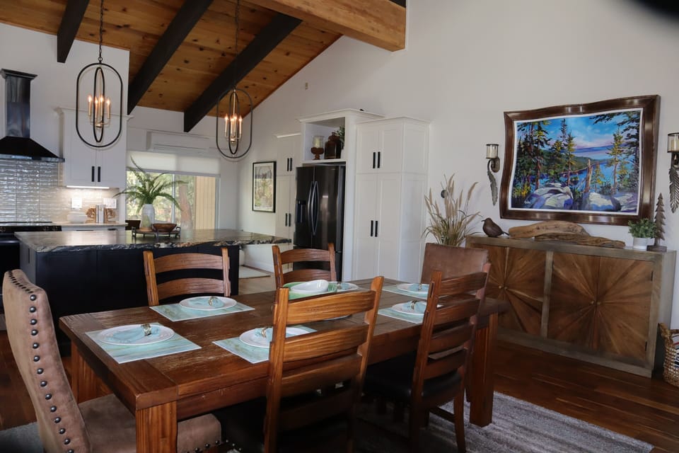 Dining and kitchen great room area with board game hutch