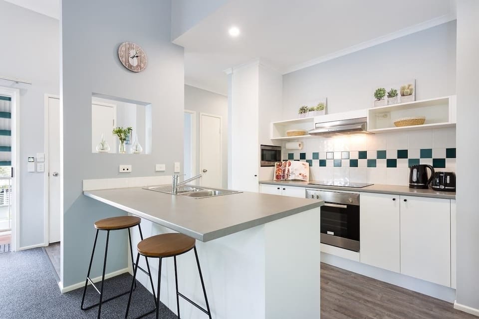 Prepare everything from slow breakfasts to evening meals in the modern kitchen, complete with full cooking facilities and generous bench space for easy holiday dining.
