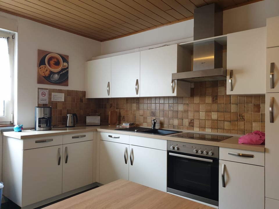 Standard Double Room, Shared Bathroom | Private kitchen | Highchair