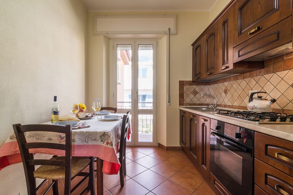 Apartment, 3 Bedrooms | Private kitchen | Full-size fridge, stovetop, cookware/dishes/utensils