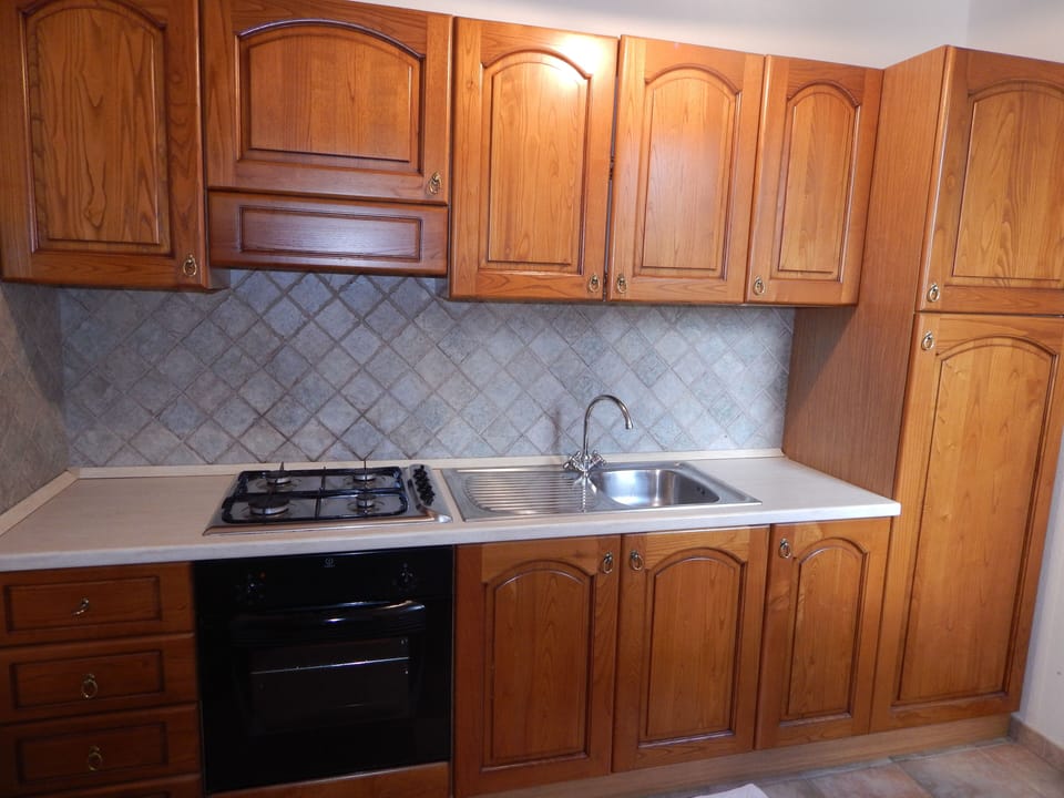 Apartment, 2 Bedrooms | Private kitchen | Full-size fridge, stovetop, cookware/dishes/utensils