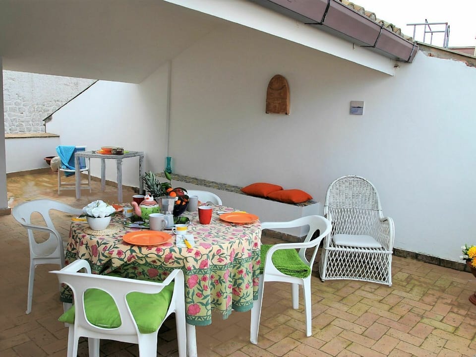 Furniture, Table, Property, Chair, Building, Flowerpot, Interior Design, Outdoor Furniture, Shade, Plant