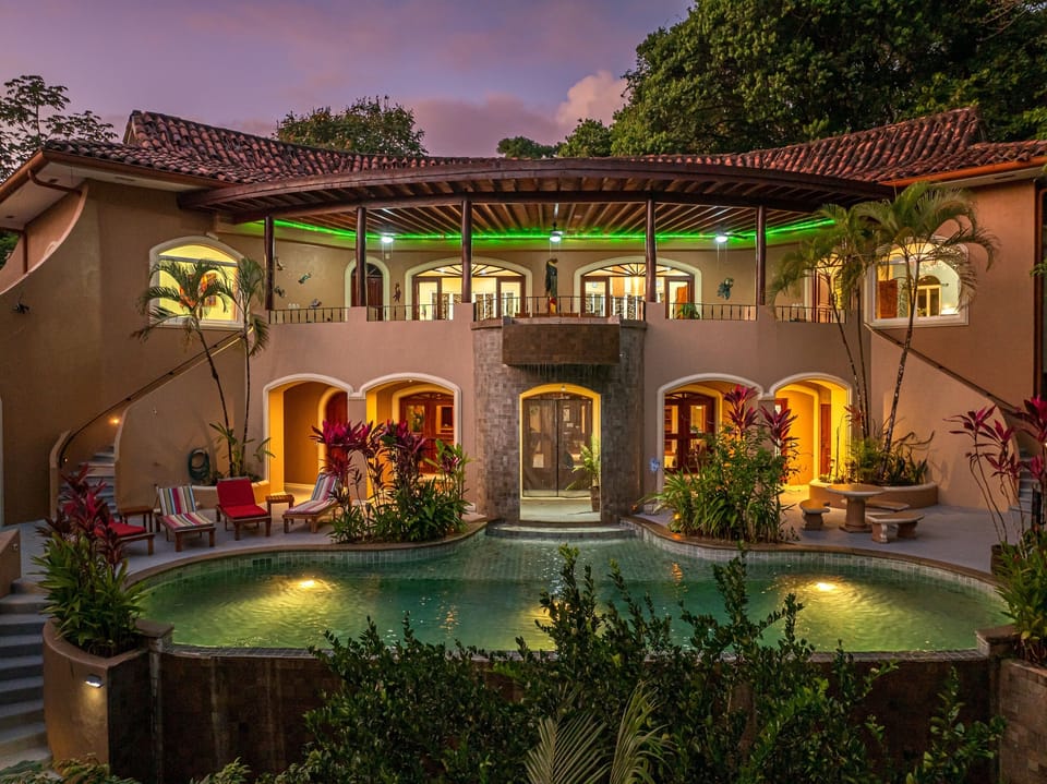 As evening falls, the home transforms into a softly lit retreat