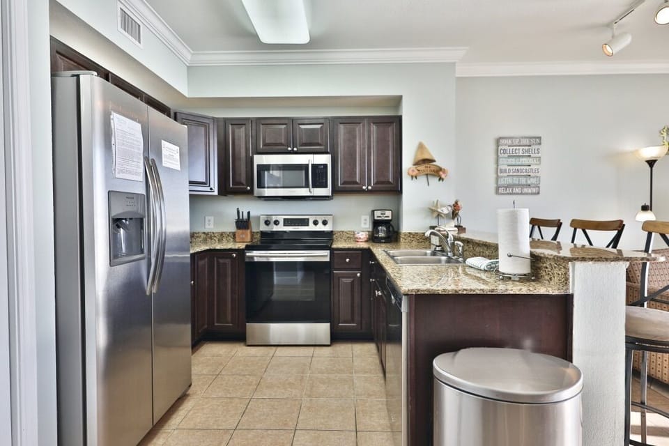Upgraded High End Kitchen Cabinets Not Standard in Tidewater Condos All Stainless Appliances and Fully Stocked for Vacation Rental Cooking
