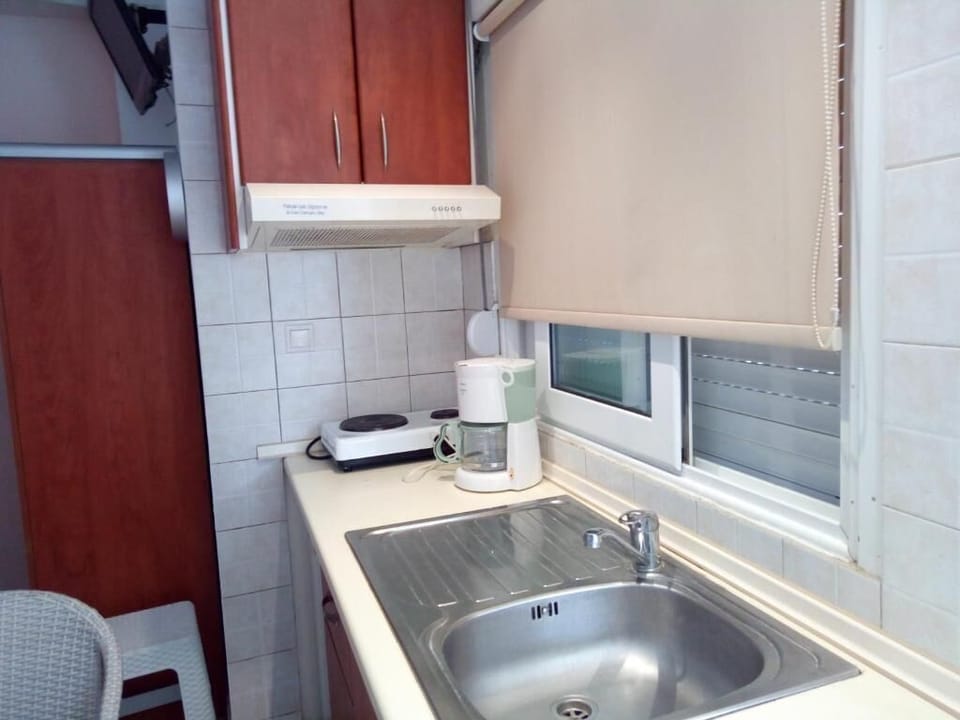 Basic Quadruple Room | Blackout drapes, iron/ironing board, free WiFi, bed sheets