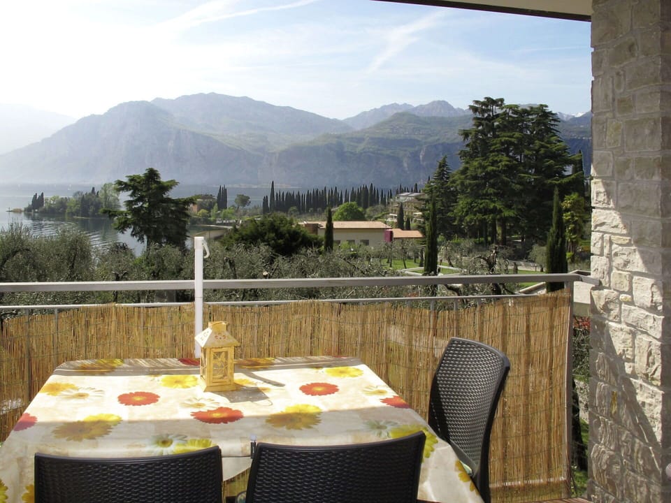 Sky, Table, Cloud, Property, Furniture, Mountain, Tableware, Chair, Tree, Plant