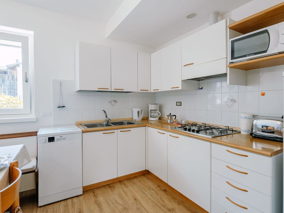 Cabinetry, Countertop, Sink, Tap, Kitchen Sink, Kitchen Stove, Wood, Kitchen Appliance, Building, Drawer