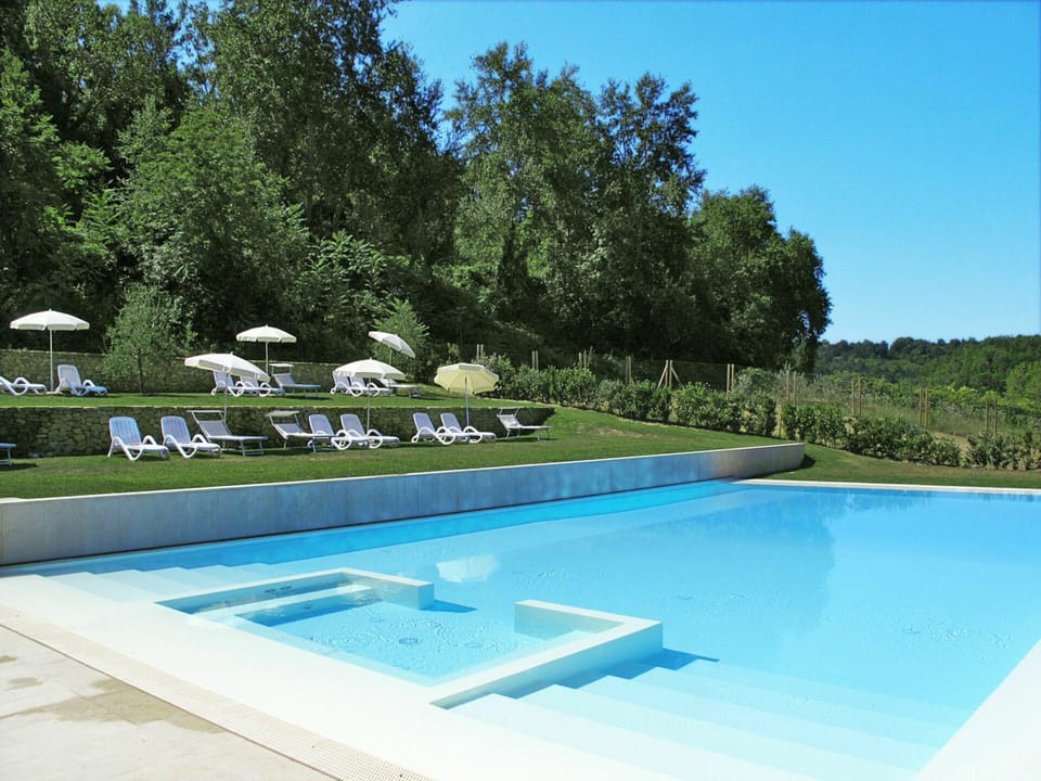 Water, Sky, Plant, Swimming Pool, Azure, Building, Shade, Rectangle, Tree, Grass