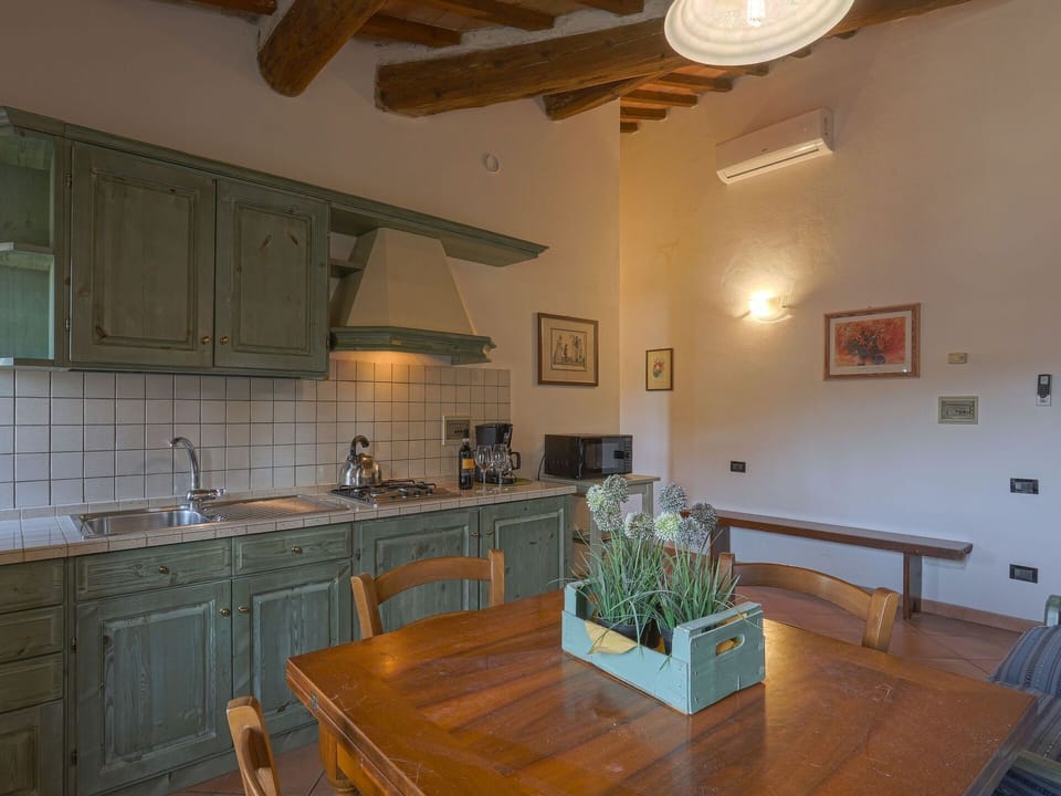 Cabinetry, Countertop, Table, Property, Furniture, Sink, Picture Frame, Wood, Tap, Lighting