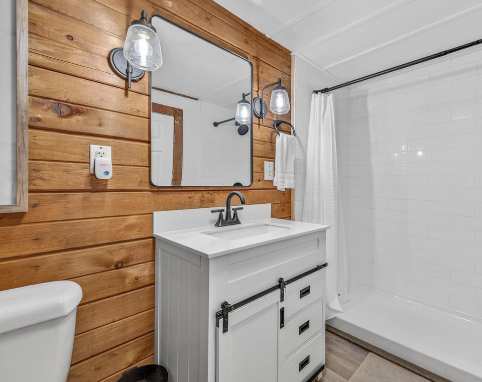 Cozy rustic bathroom with modern fixtures and bright lighting