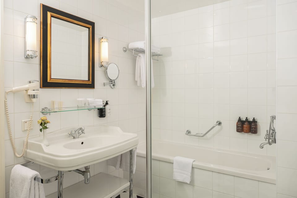 Combined shower/tub, free toiletries, hair dryer, bathrobes