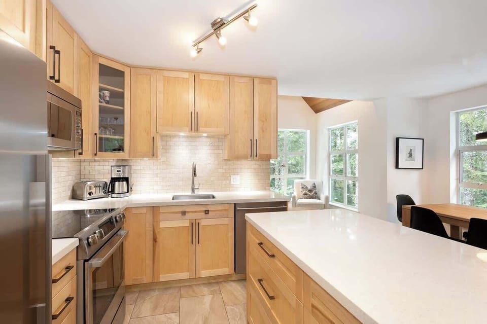- Bright Whistler kitchen with sleek quartz countertops  
- Modern appliances and wooden cabinetry create alpine charm  
- Perfect for family cooking and cozy mountain gatherings  
