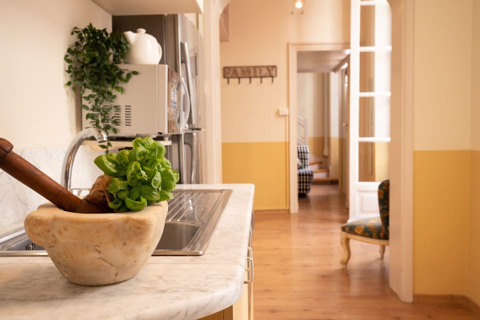 Apartment, 2 Bedrooms | Private kitchen | Full-size fridge, stovetop, highchair, cookware/dishes/utensils