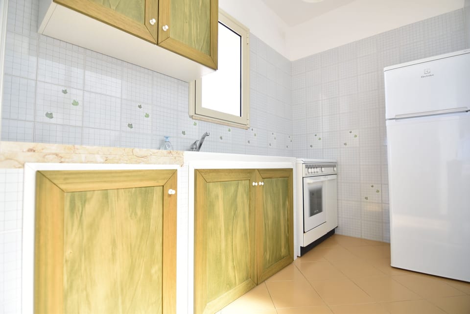 Apartment, 2 Bedrooms | Private kitchen | Full-size fridge, oven, stovetop, cookware/dishes/utensils