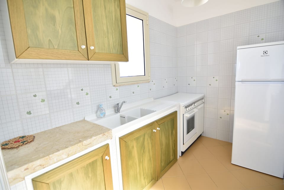 Apartment, 2 Bedrooms | Private kitchen | Full-size fridge, oven, stovetop, cookware/dishes/utensils