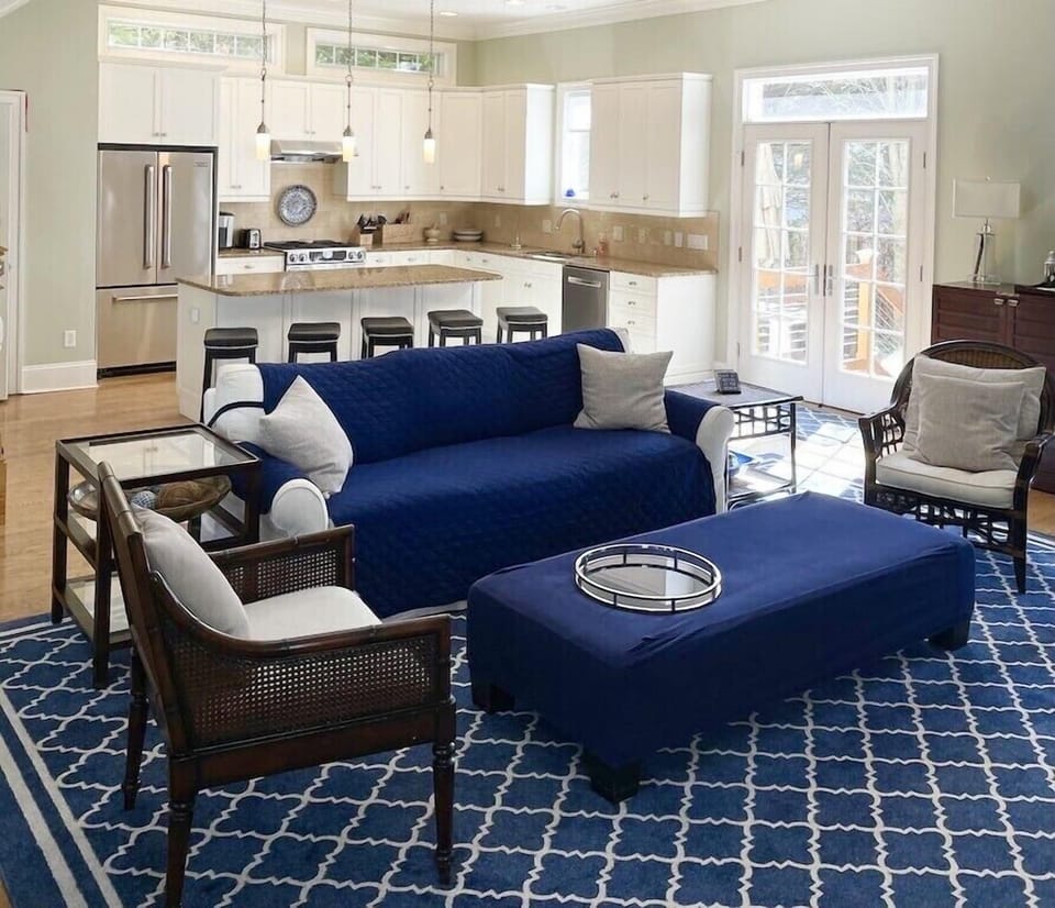 Kitchen features Jenn Air stainless steel appliances & large granite island. 