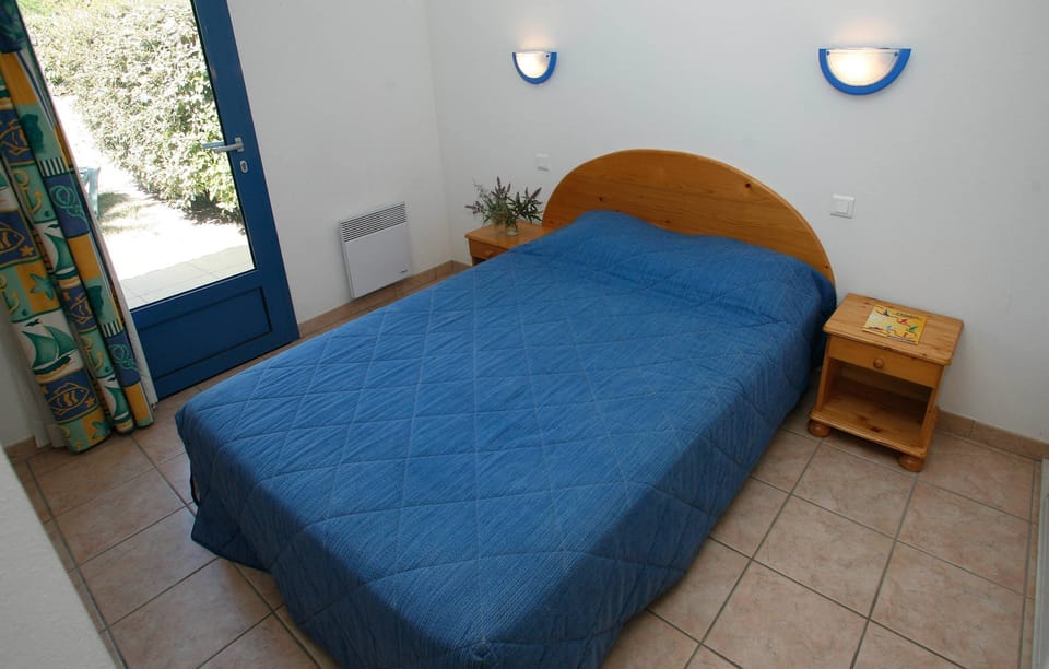 The master bedroom features a cozy Double bed.