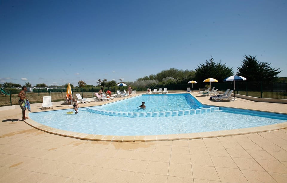 Dive into the lovely outdoor pool, open from May to September!