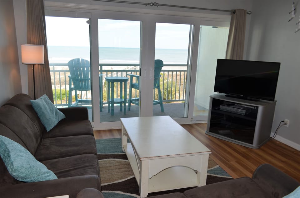 Unwind watching TV or the crashing waves!