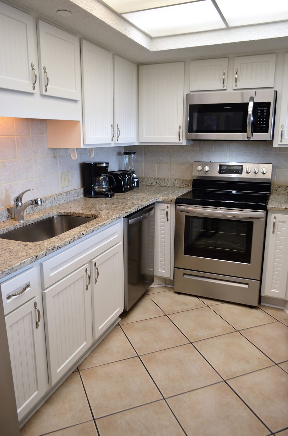Fully Equipped Kitchen with Granite Countertops