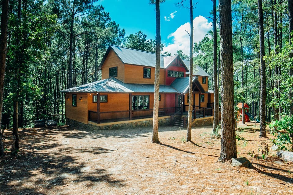 Luxury lodge tucked in towering pines—private, peaceful, and secluded.