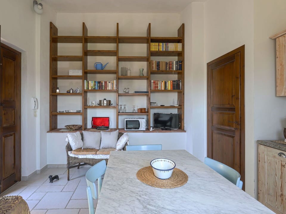 Furniture, Cabinetry, Property, Table, Bookcase, Shelf, Wood, Interior Design, Lighting, Picture Frame