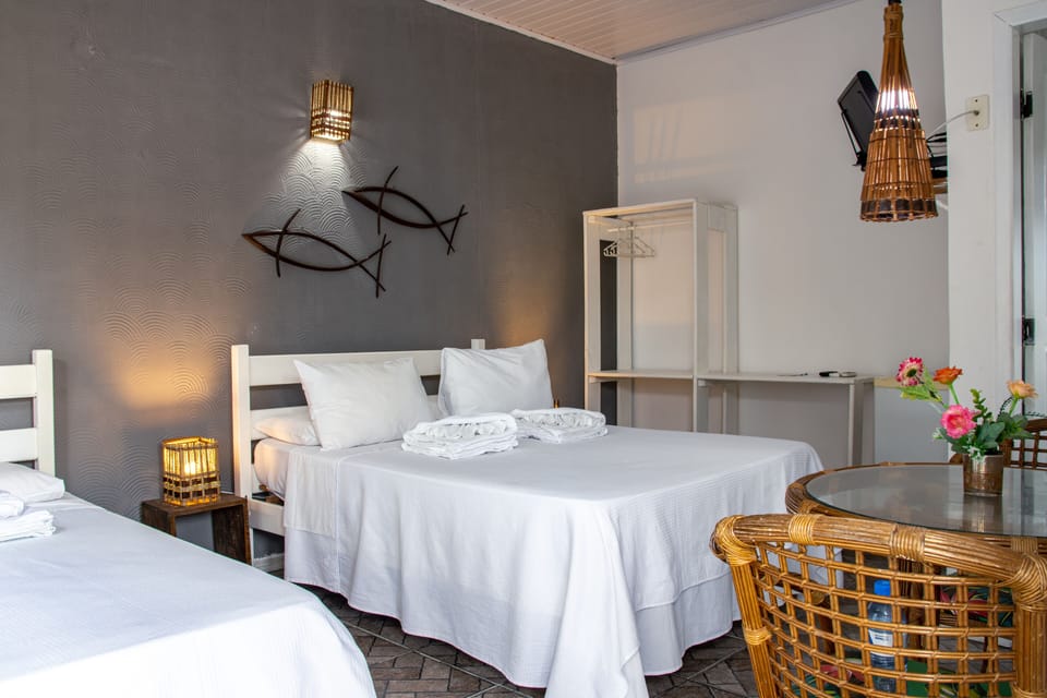 Basic Triple Room | Minibar, blackout drapes, iron/ironing board (on request), WiFi (free)
