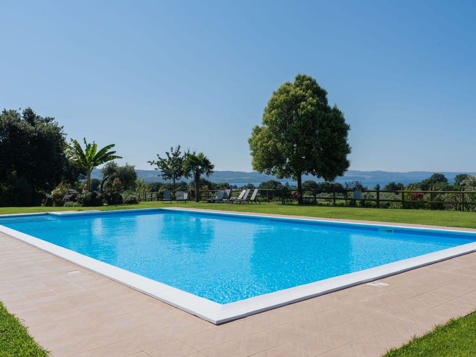 Water, Property, Sky, Swimming Pool, Plant, Azure, Tree, Rectangle, Building, Grass