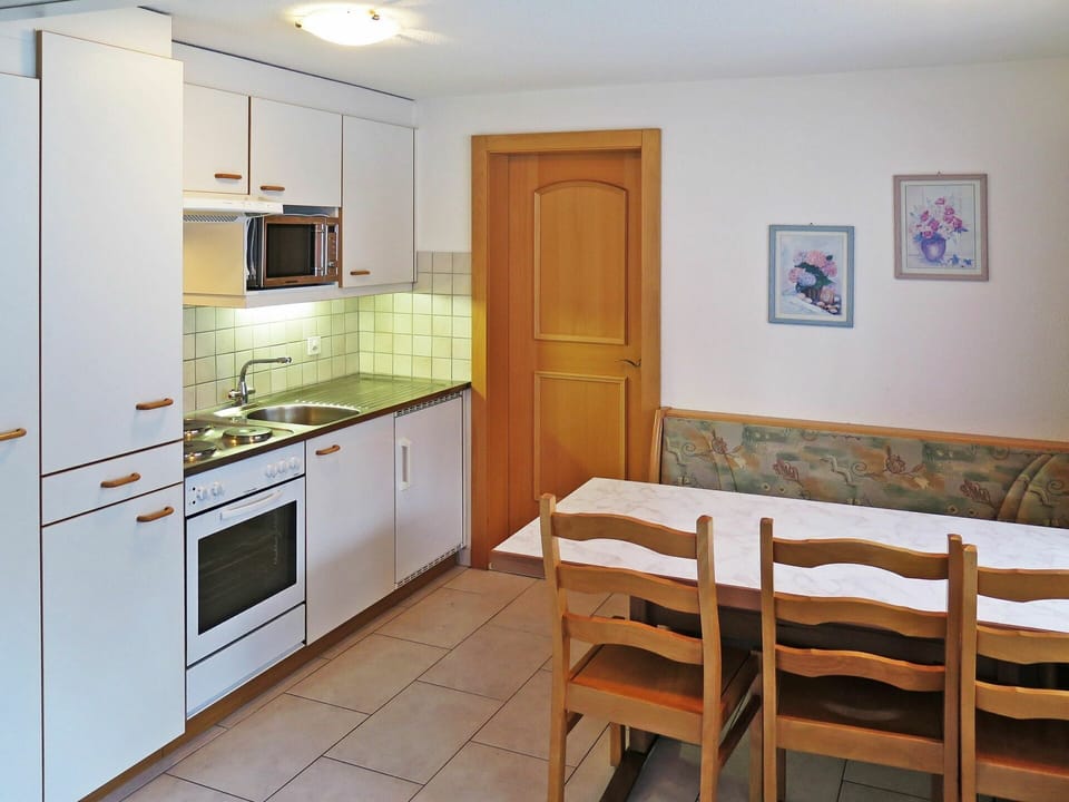 Cabinetry, Furniture, Countertop, Chair, Sink, Building, Kitchen Appliance, Kitchen Stove, Drawer, Home Appliance
