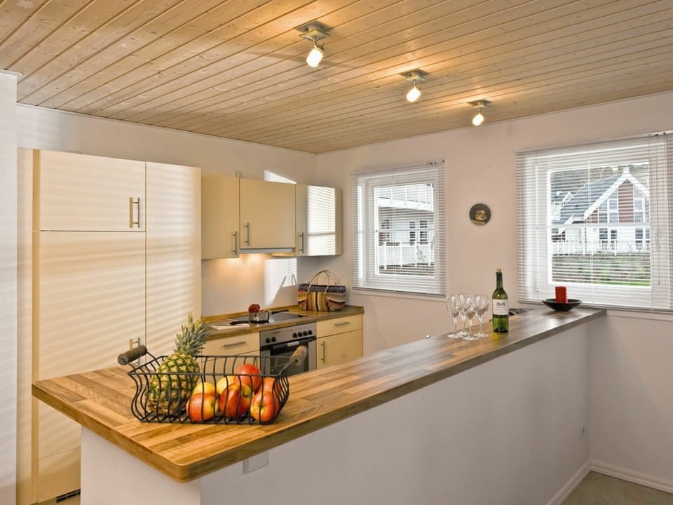 Room, Countertop, Property, Ceiling, Furniture, Kitchen, Interior Design, Building, Yellow, Cabinetry