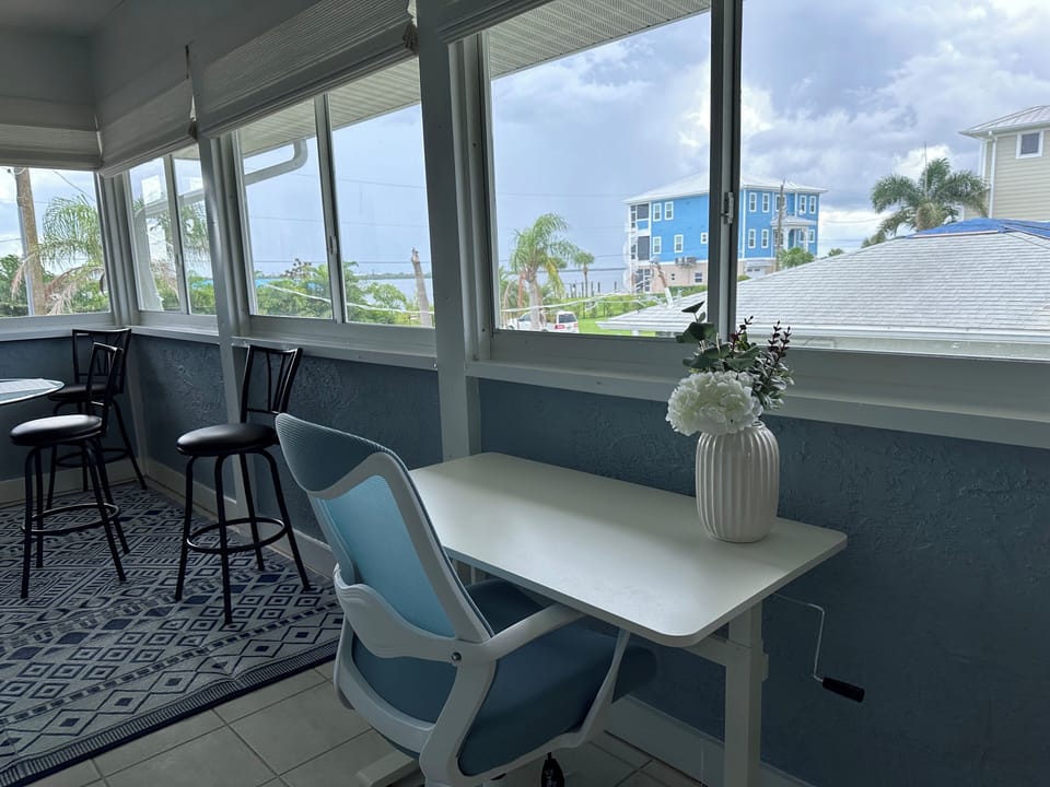Adjustable standing desk with views of the intercoastal